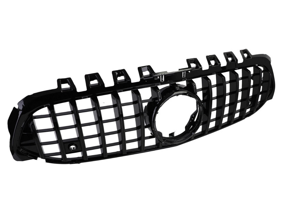 A black car grille, featuring vertical and horizontal slats with a central circular opening, is set against a plain white background.