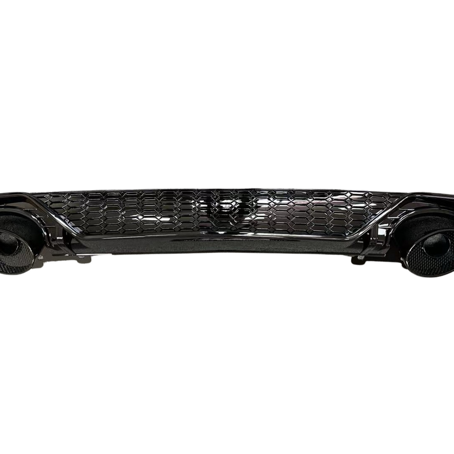 A glossy black car bumper with a honeycomb grille design, featuring circular exhaust openings on each side, isolated against a white background.
