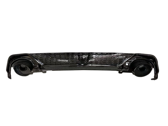 A glossy black car bumper with a honeycomb grille design, featuring circular exhaust openings on each side, isolated against a white background.