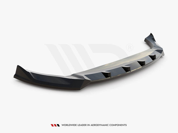 A black car bumper lip spoiler, angled with aerodynamic features, rests on a plain white background. Text reads “WORLDWIDE LEADER IN AERODYNAMIC COMPONENTS.”