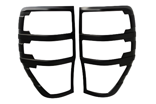 Black metal grille covers are side by side, divided into three slots each. They are intended for vehicle tail lights, set against a plain white background.