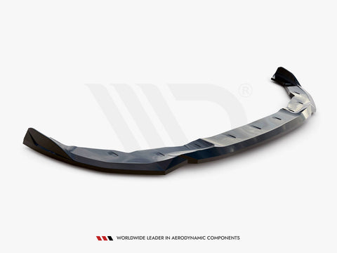 A sleek, black aerodynamic car lip spoiler rests on a plain white background. Text reads: "WORLDWIDE LEADER IN AERODYNAMIC COMPONENTS."