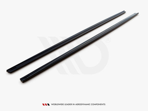 Two black, elongated strips are laid parallel on a light surface. Text reads, "WORLDWIDE LEADER IN AERODYNAMIC COMPONENTS."