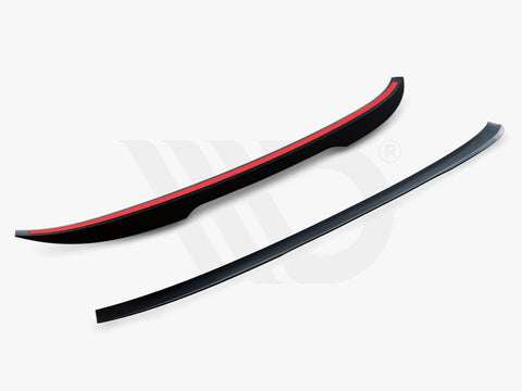 Two aerodynamic car components, both curved black strips with red accents, are placed on a white background. Text reads, "WORLDWIDE LEADER IN AERODYNAMIC COMPONENTS."
