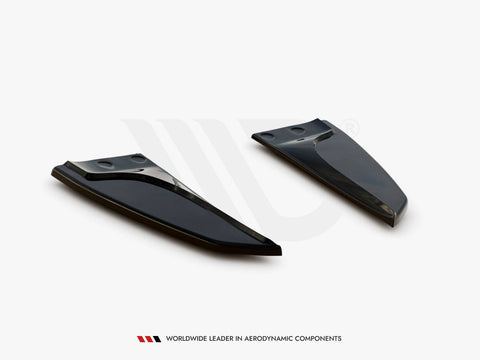 Two sleek, black aerodynamic components are positioned on a plain white background. Text at the bottom reads: "WORLDWIDE LEADER IN AERODYNAMIC COMPONENTS."