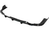 A sleek, black car bumper lip spoiler rests against a white background. It features aerodynamic curves and angled ends, designed to enhance vehicle aesthetics and performance.