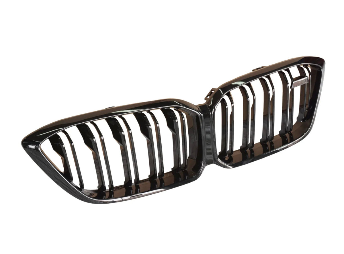 A shiny, black double-kidney car grill with vertical slats is laid out against a plain white background, likely for a vehicle's front exterior.
