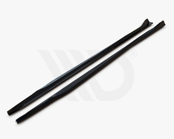 Two long, black aerodynamic components lie parallel on a white surface, with text, "WORLDWIDE LEADER IN AERODYNAMIC COMPONENTS," displayed underneath.