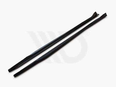 Two long, black aerodynamic components lie parallel on a white surface, with text, "WORLDWIDE LEADER IN AERODYNAMIC COMPONENTS," displayed underneath.