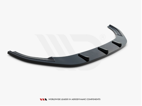 A black aerodynamic car component with five fins is displayed on a white background. Text below reads: “WORLDWIDE LEADER IN AERODYNAMIC COMPONENTS.”