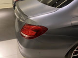 A gray luxury car's rear with 