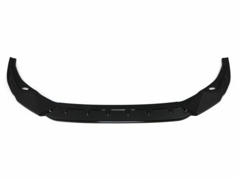A black car front lip spoiler, featuring an angular, aerodynamic design, lies against a plain white background, emphasizing its sleek structure.