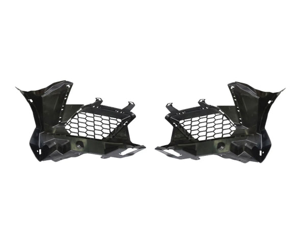 Two black plastic car components with honeycomb cutouts are symmetrically positioned. They have angular designs, suggesting automotive parts, likely for ventilation or structural support. Plain white background.