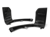 Two black carbon fiber car components are displayed on a white background, featuring curved structures with flat sections, likely designed for aerodynamic purposes.
