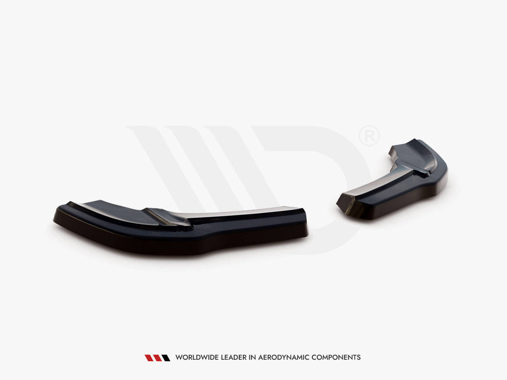 Black aerodynamic car components rest on a white surface in a studio setting. Text below reads: "WORLDWIDE LEADER IN AERODYNAMIC COMPONENTS."
