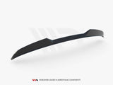 A sleek black aerodynamic spoiler, displayed on a white background, slightly curved with sharp edges. Text below reads: 