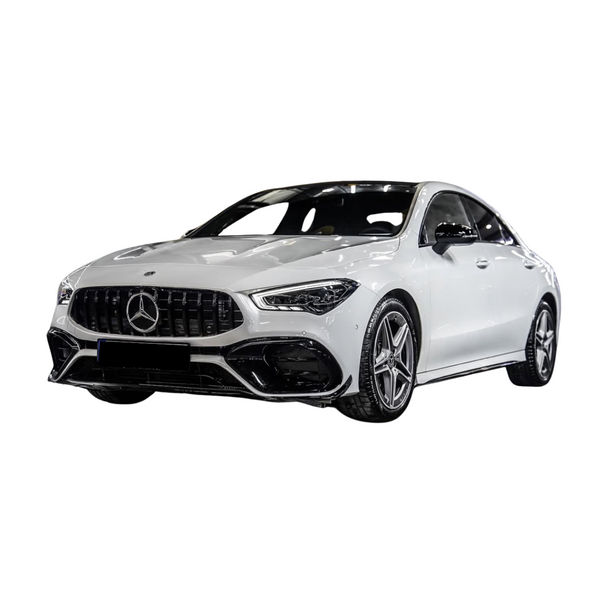 A white Mercedes sedan with a sleek design and star emblem grille is parked, showcasing its modern styling and five-spoke alloy wheels against a plain white background.