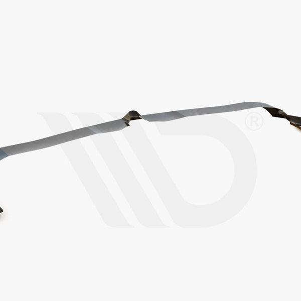 A dark, elongated car spoiler rests on a plain white background. It features angular end sections. Text reads: "WORLDWIDE LEADER IN AERODYNAMIC COMPONENTS" below the spoiler.