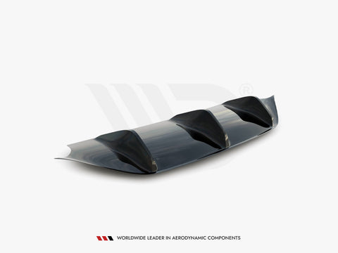 A sleek, dark aerodynamic car diffuser featuring three fins, positioned on a white background. Below it, text reads: “WORLDWIDE LEADER IN AERODYNAMIC COMPONENTS.”