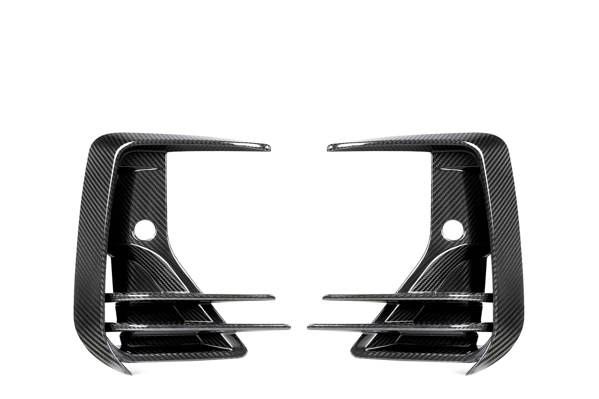 Two carbon fiber air vents, mirror each other, featuring three horizontal slats and a rounded hole in the center against a white background.