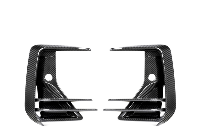 Two carbon fiber air vents, mirror each other, featuring three horizontal slats and a rounded hole in the center against a white background.