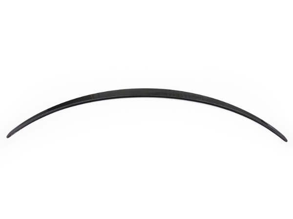 A long, curved, black strip rests against a white background, displaying a sleek, aerodynamic design, potentially part of a vehicle or similar structure.