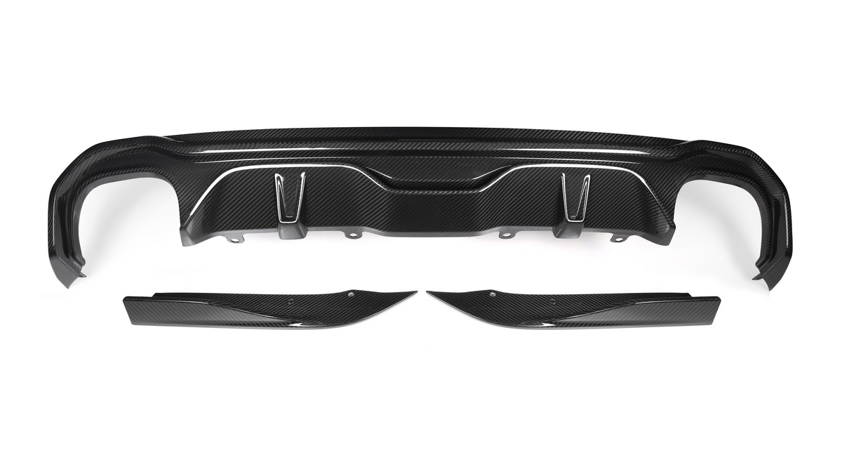 A black carbon fiber car bumper diffuser set rests on a white background, featuring aerodynamic contours and mounting points, showcasing its lightweight and sporty design.