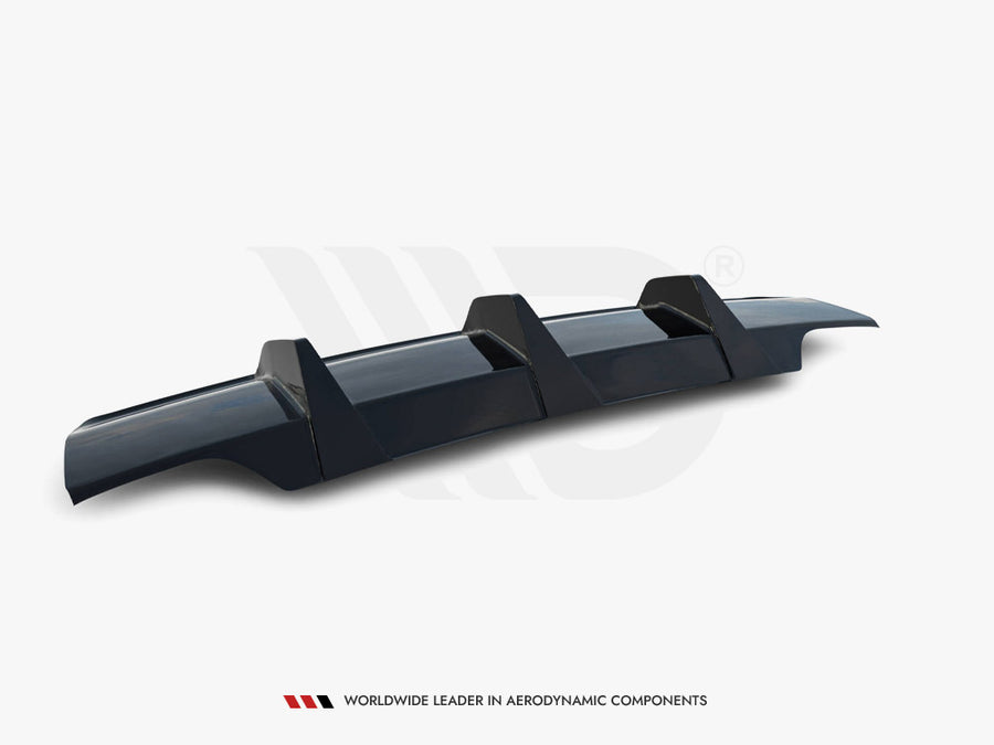 A sleek, dark-colored car rear diffuser with three vertical fins, positioned on a plain white background. Text: "WORLDWIDE LEADER IN AERODYNAMIC COMPONENTS" at the bottom.