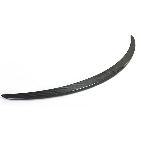 A sleek, black, curved car spoiler rests on a plain white background, highlighting its streamlined design and subtle texture.