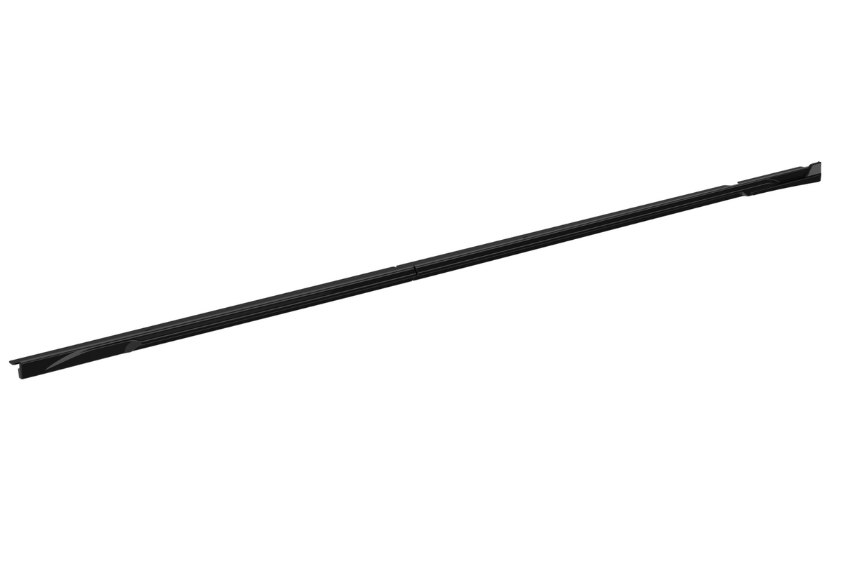 A long, slender black rod lies diagonally across a white background, featuring subtle grooves and tapered ends, suggesting a sleek, minimalist design.