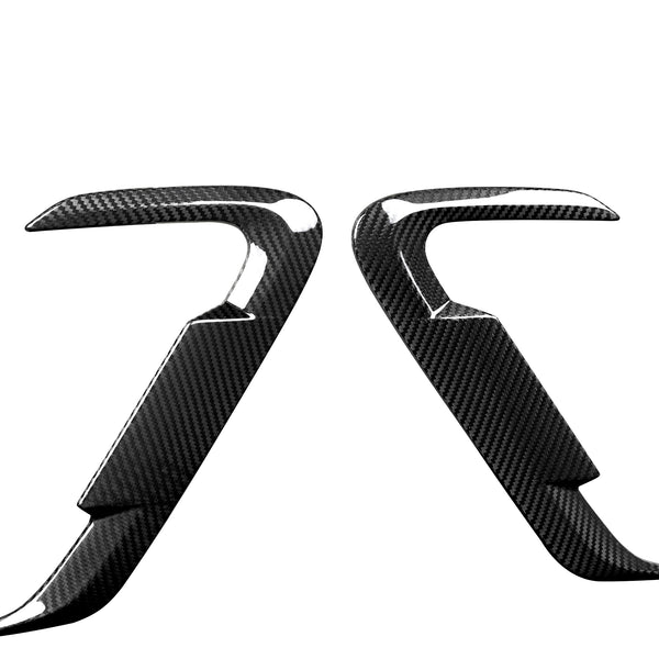 Two curved, carbon fiber-textured car accessory pieces facing each other, against a white background. They feature glossy, reflective surfaces with an angular, aerodynamic design.
