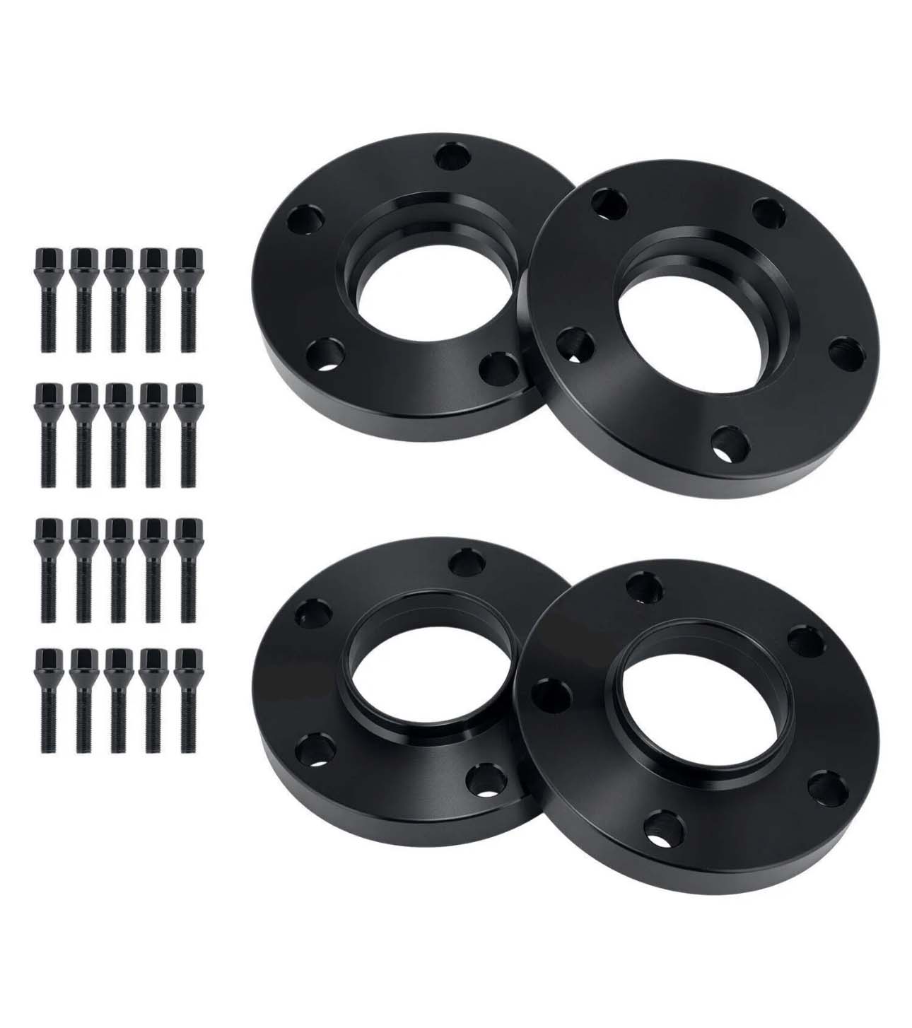 Four black wheel spacers with circular holes are laid out on a white surface, accompanied by sixteen matching screws arranged in two vertical rows.