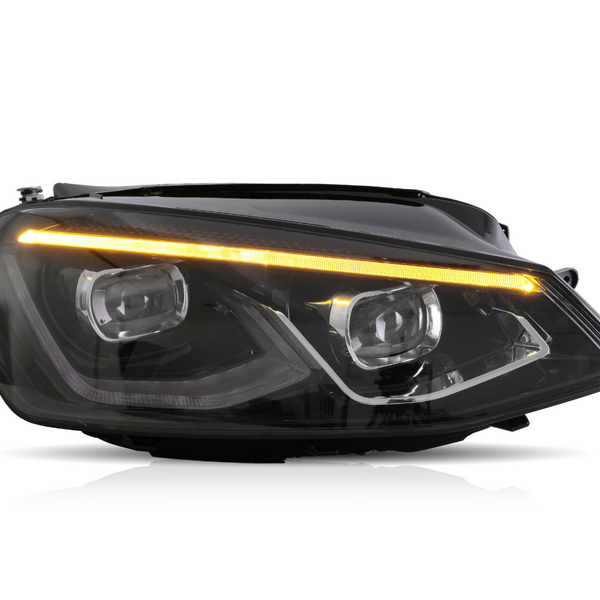 A sleek car headlight with dual LED projectors and an amber LED strip is illuminated against a plain white background, highlighting its modern design.