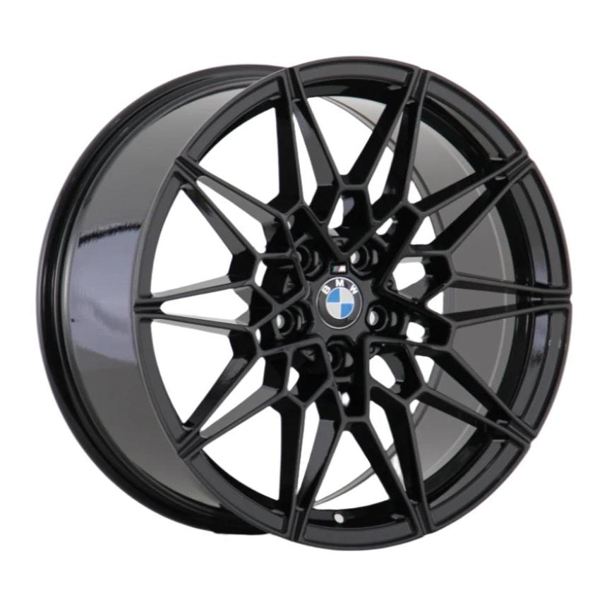A black alloy wheel features a complex, geometric spoke design centered by a BMW logo, displayed against a plain white background.