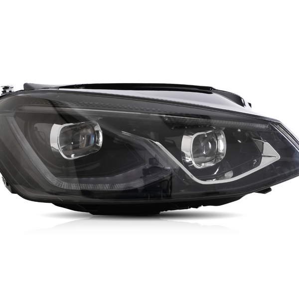 A sleek car headlight features dual reflector lamps, surrounded by black and chrome accents, isolated against a white background.