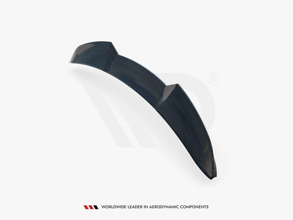 A curved, sleek black automotive spoiler is presented at an angle, on a plain white background. Text reads, "WORLDWIDE LEADER IN AERODYNAMIC COMPONENTS" at the bottom.
