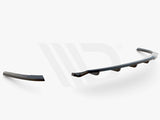 A three-piece black aerodynamic car component lies on a plain white background. Text below reads 