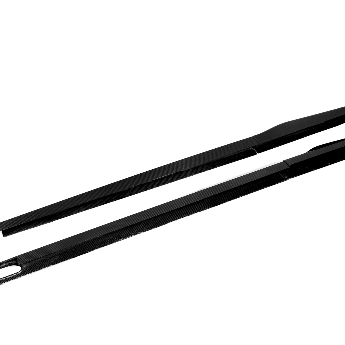 Two long, black carbon fiber strips lay parallel on a white background. One strip features an elongated hole, and both have slight angled ends.