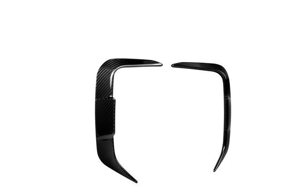 Two glossy, black, carbon fiber car bumper trim pieces are displayed against a plain white background, positioned opposite each other, forming a partial rectangular frame.