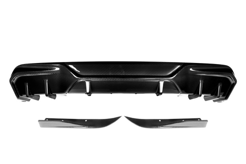 Carbon fiber car bumper with sleek contours and angular design, displayed against a plain white background, emphasizing its glossy texture and aerodynamic style.