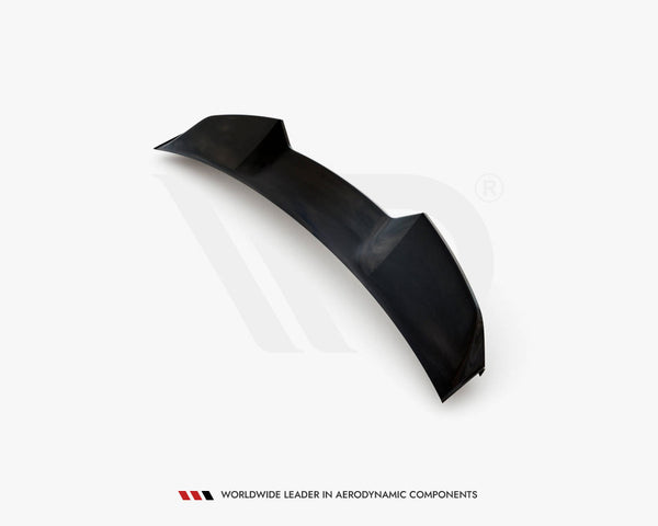 A black car spoiler, featuring aerodynamic contours, sits isolated on a white background. Text below reads: "Worldwide Leader in Aerodynamic Components."