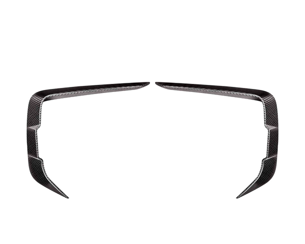 Two symmetrical, angled carbon fiber trim pieces facing each other on a plain white background, resembling elongated, curved brackets or stylized boomerangs.