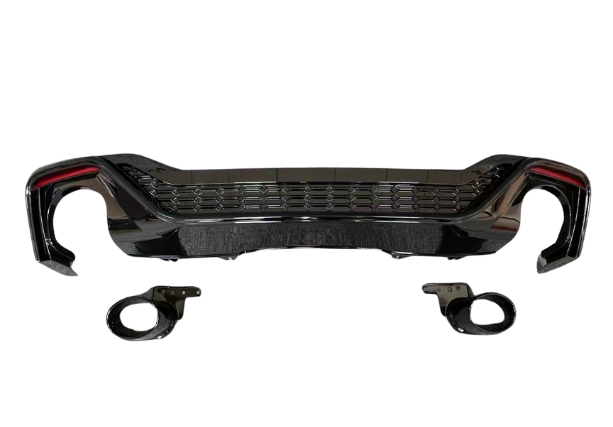 A glossy black car bumper with honeycomb grille design is displayed against a white background, accompanied by two matching circular pieces positioned below it.