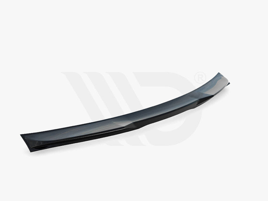 A black aerodynamic car spoiler, curved and streamlined, lies on a plain white background. Text below reads: "WORLDWIDE LEADER IN AERODYNAMIC COMPONENTS."