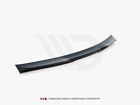 A black aerodynamic car spoiler, curved and streamlined, lies on a plain white background. Text below reads: "WORLDWIDE LEADER IN AERODYNAMIC COMPONENTS."