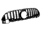 A black car grille with vertical slats features a central circular opening, set against a plain white background, designed for vehicle front-end aesthetics and ventilation.