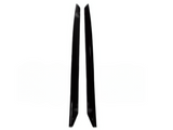 Two black objects, possibly blades or panel pieces, stand upright in parallel, facing inward against a plain white background.