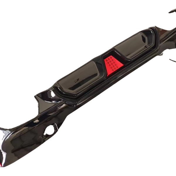 A sleek black car bumper features integrated red reflectors, positioned against a plain white background.