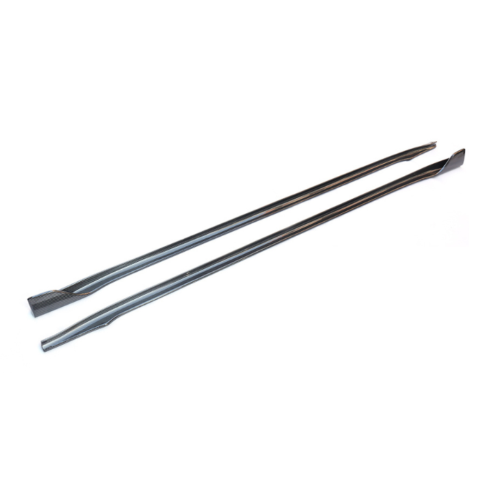 Two long, slender metal tools with flat, angled ends lie parallel on a white surface, designed for prying or lifting tasks in mechanical or construction contexts.