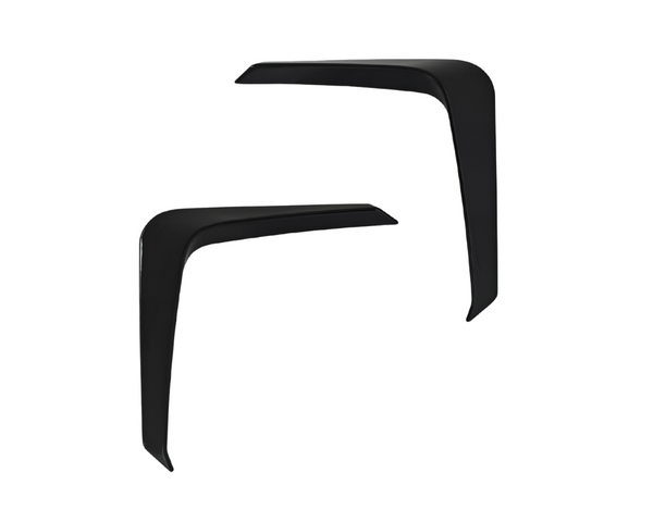Two black, angled objects are positioned facing each other, resembling boomerangs. They are set against a plain white background.